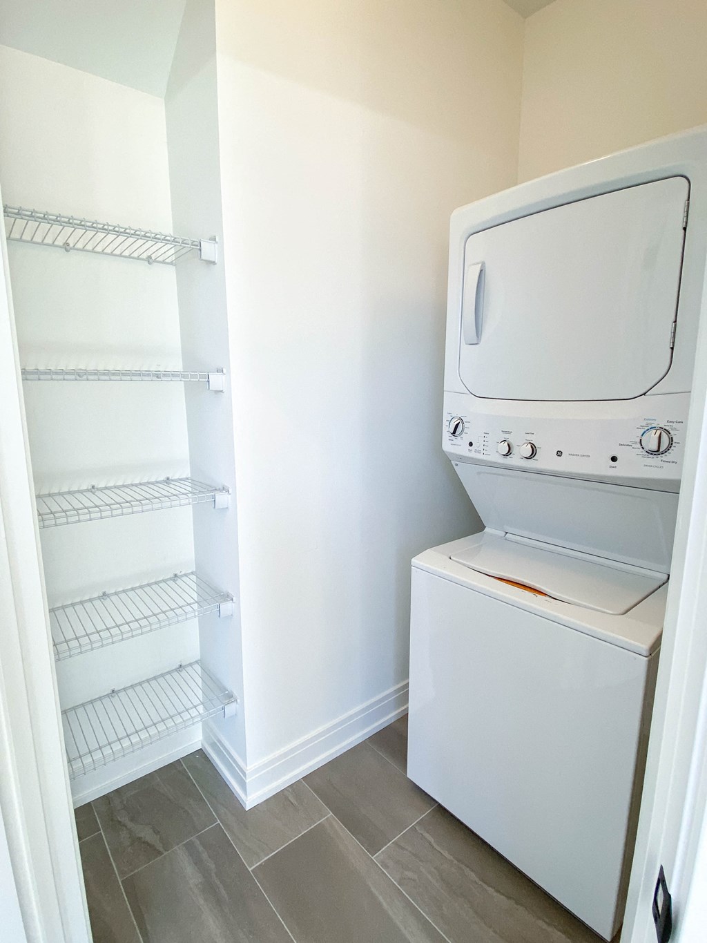 a small laundry room with a washer and dryer