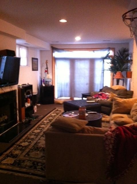 a living room with a couch and a tv