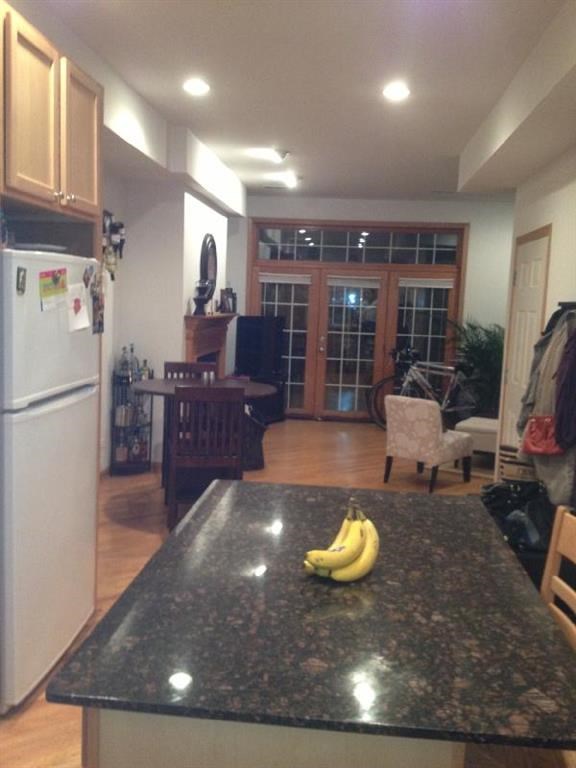a kitchen with a counter top with bananas on it