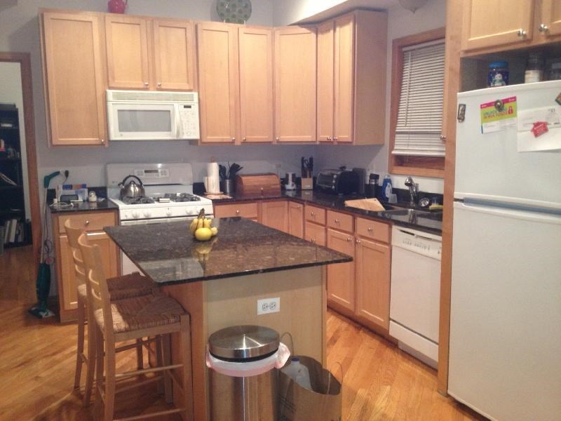 a kitchen with wooden cabinets and a counter top