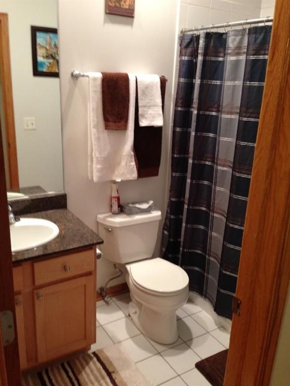 a small bathroom with a toilet and a shower