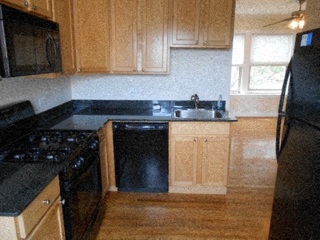 a kitchen with a stove and a sink