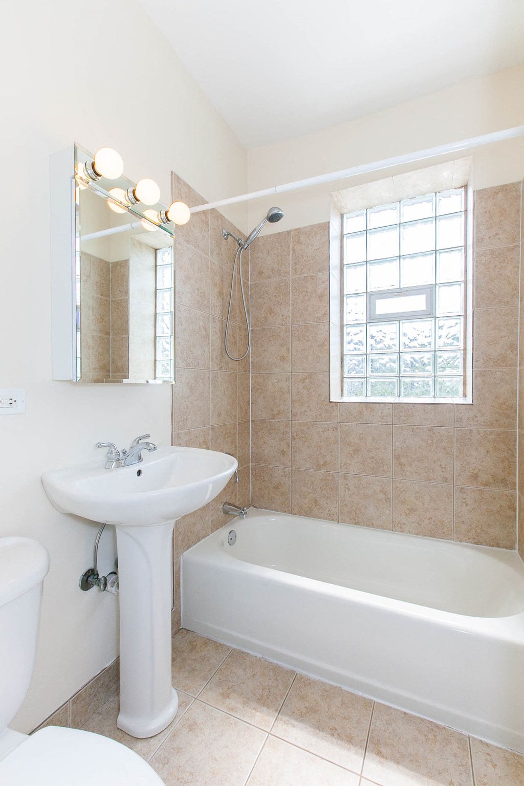 a bathroom with a sink and a bath tub