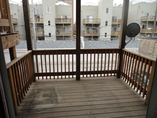 a view of a balcony with a wooden deck
