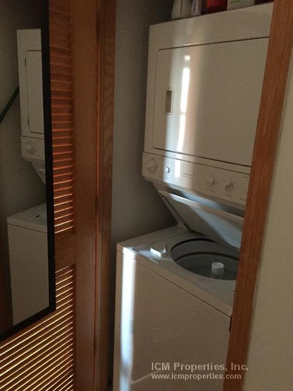 a bathroom with a washer and a dryer in it
