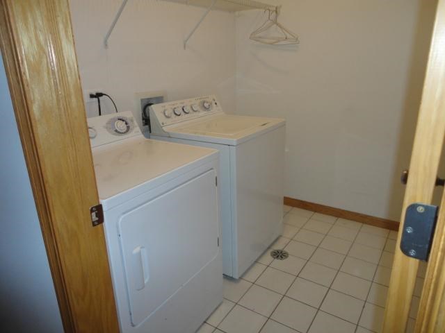 a laundry room with a washer and a dryer in it