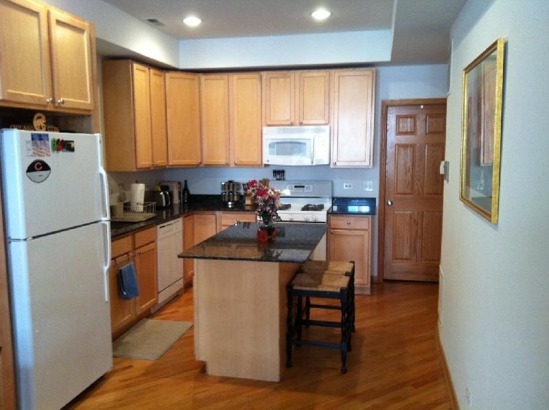 a kitchen with wooden cabinets and a counter top