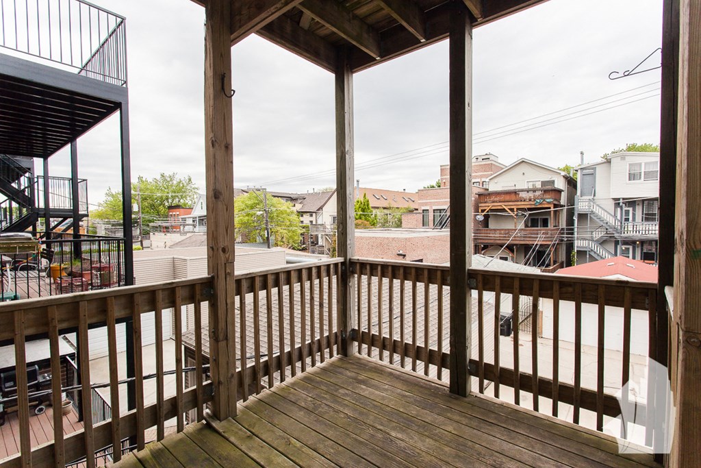 the deck has a view of the neighborhood and the city