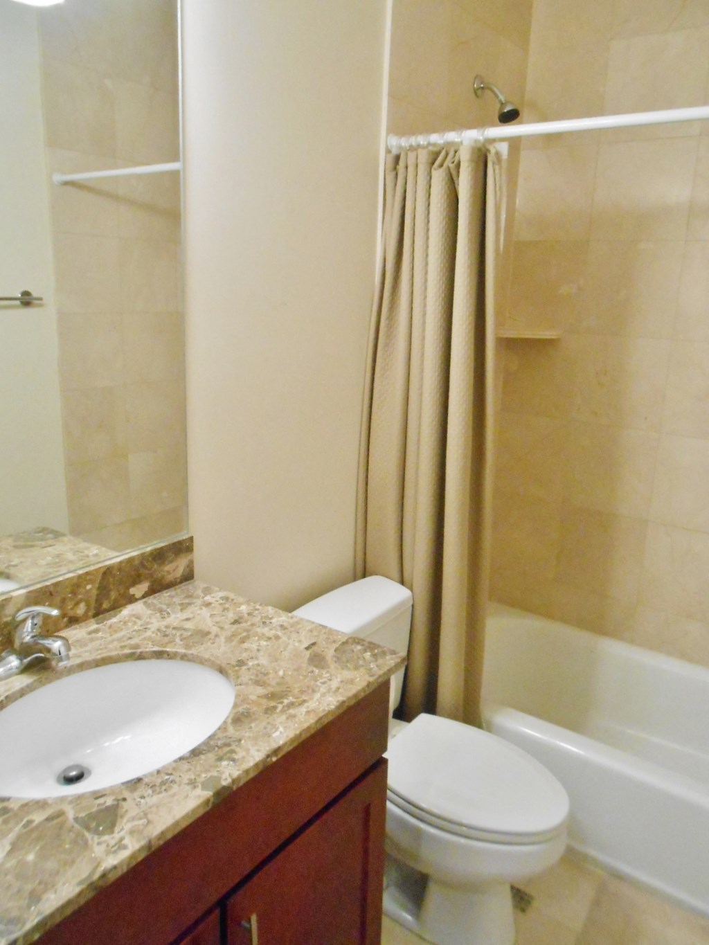 a bathroom with a sink toilet and a shower