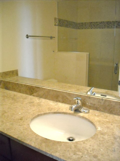 a bathroom with a sink and a mirror