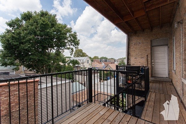 a balcony with a view of a city