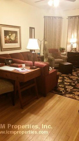 a living room with a couch and a table