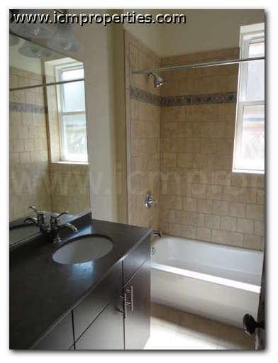 a bathroom with a sink and a bath tub