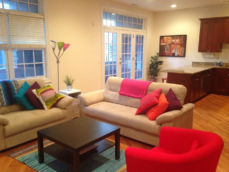 a living room with couches and chairs and a table
