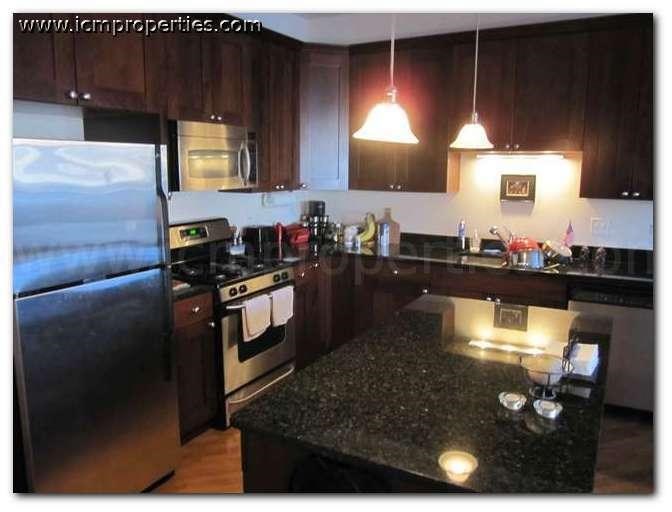 a kitchen with stainless steel appliances and granite counter tops