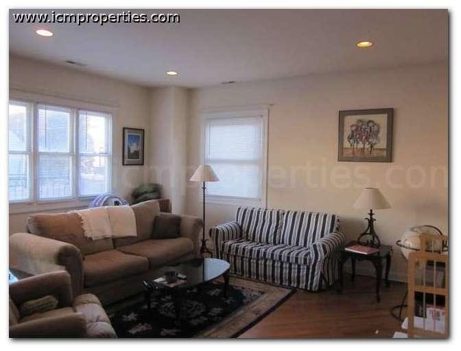 a living room with a couch and a chair