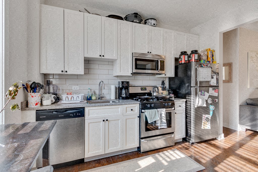 a kitchen with a stove and a refrigerator
