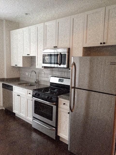 a kitchen with a stove microwave and refrigerator