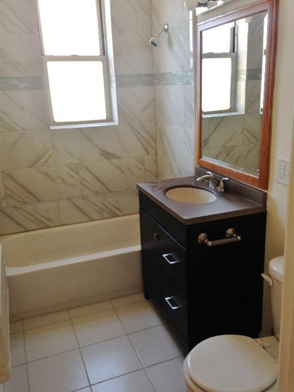 a bathroom with a sink and a toilet and a shower