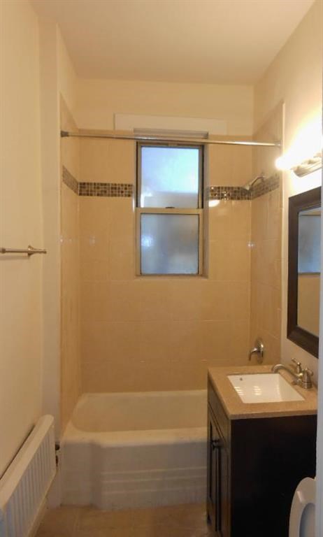 a small bathroom with a sink and a shower