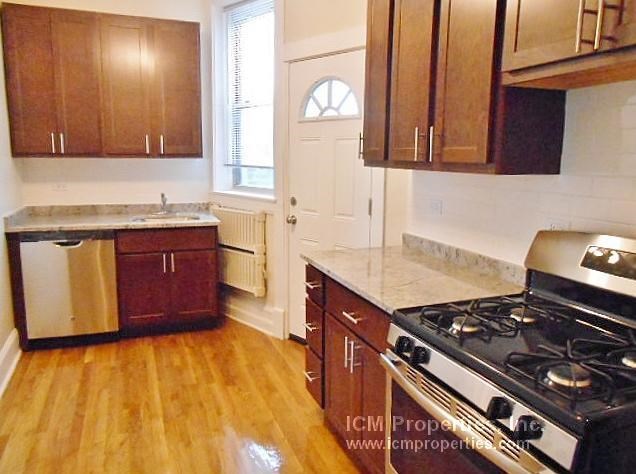 a kitchen with a stove and a sink