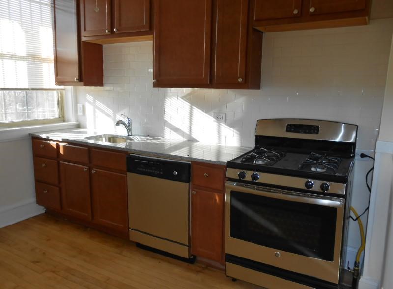 a kitchen with a stove and a sink