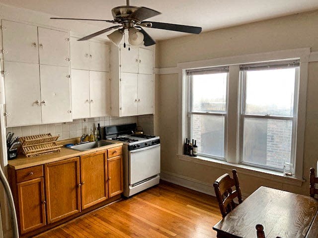 a kitchen with a stove and a table