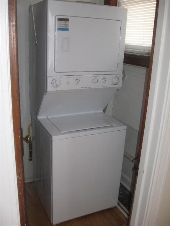a white washer and dryer in a small room