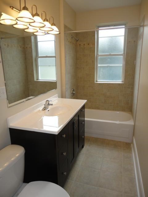 a bathroom with a sink and a toilet and a tub