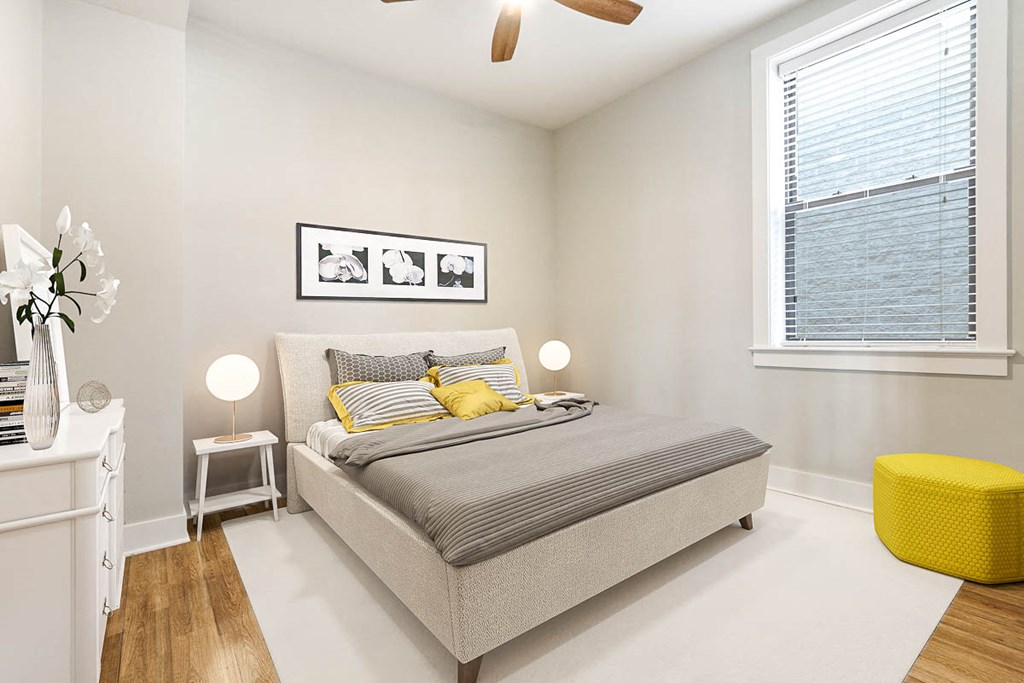 a bedroom with a bed and a window