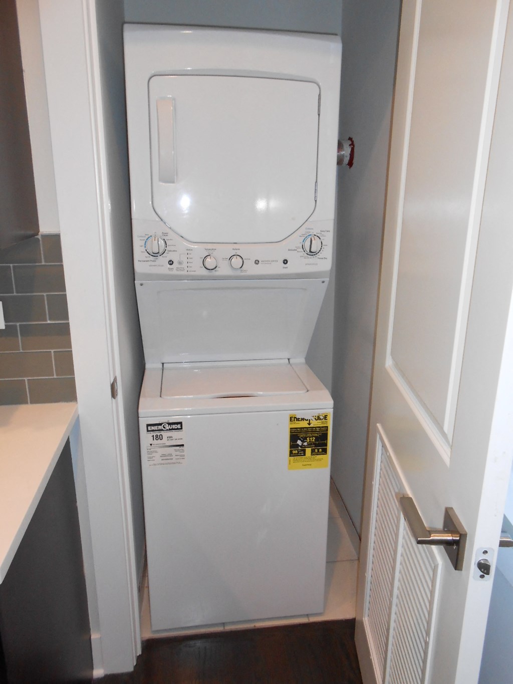 a white washer and dryer in a small room