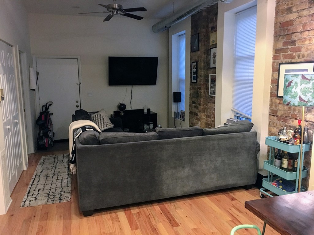 a living room with a couch and a tv