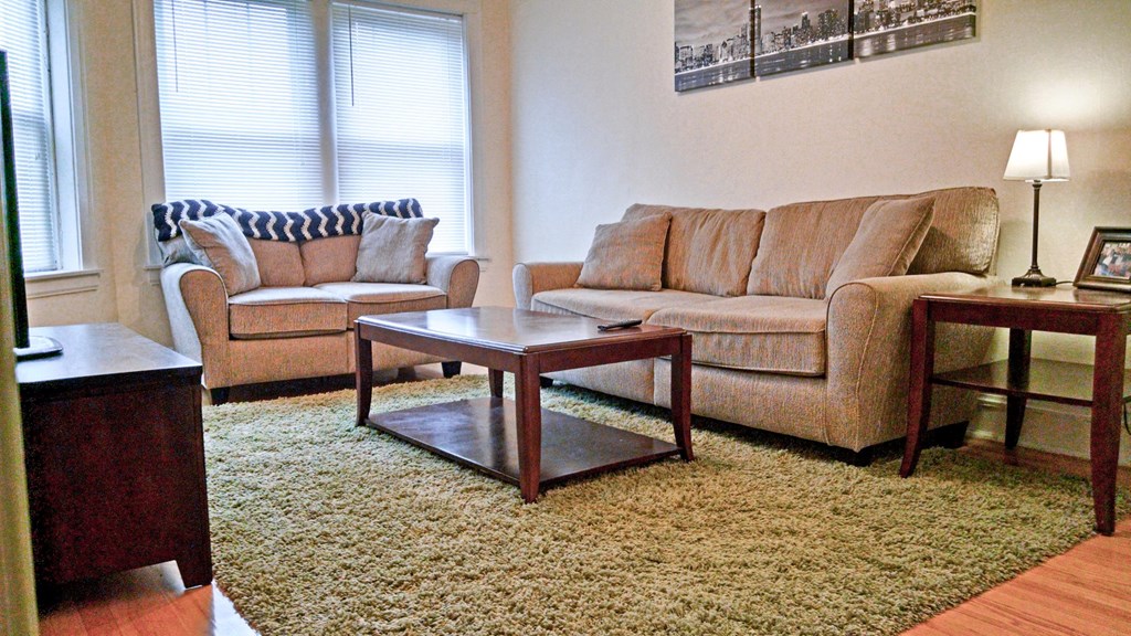 a living room with couches and a coffee table