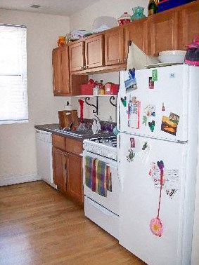 a kitchen with a stove and a refrigerator