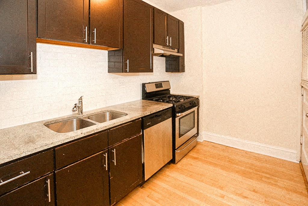 a kitchen with a sink and a stove