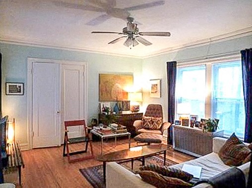 a living room with a ceiling fan and a