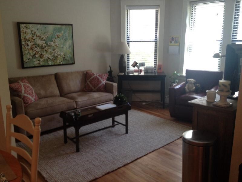 a living room with a couch and a table