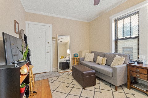 a living room with a couch and a tv