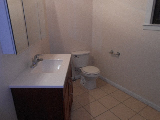 a bathroom with a toilet and a sink