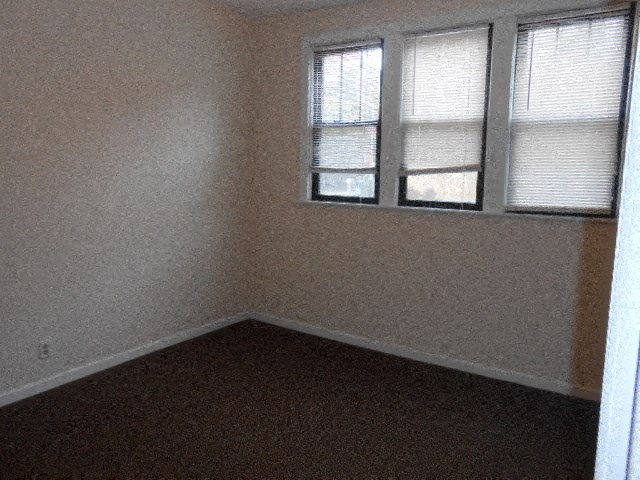 an empty room with a window in it