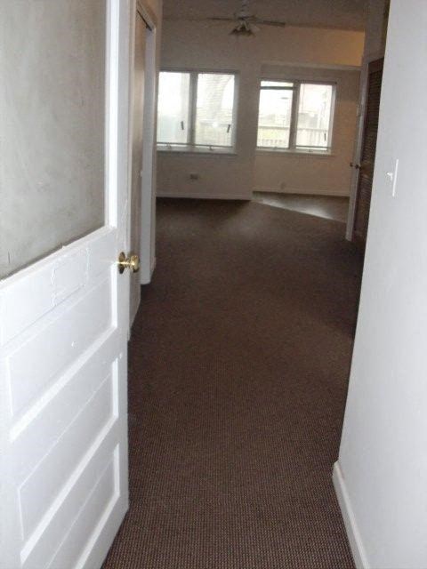 an empty living room with a white door