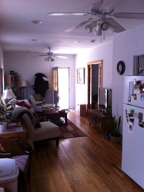 a living room with a hard wood floor