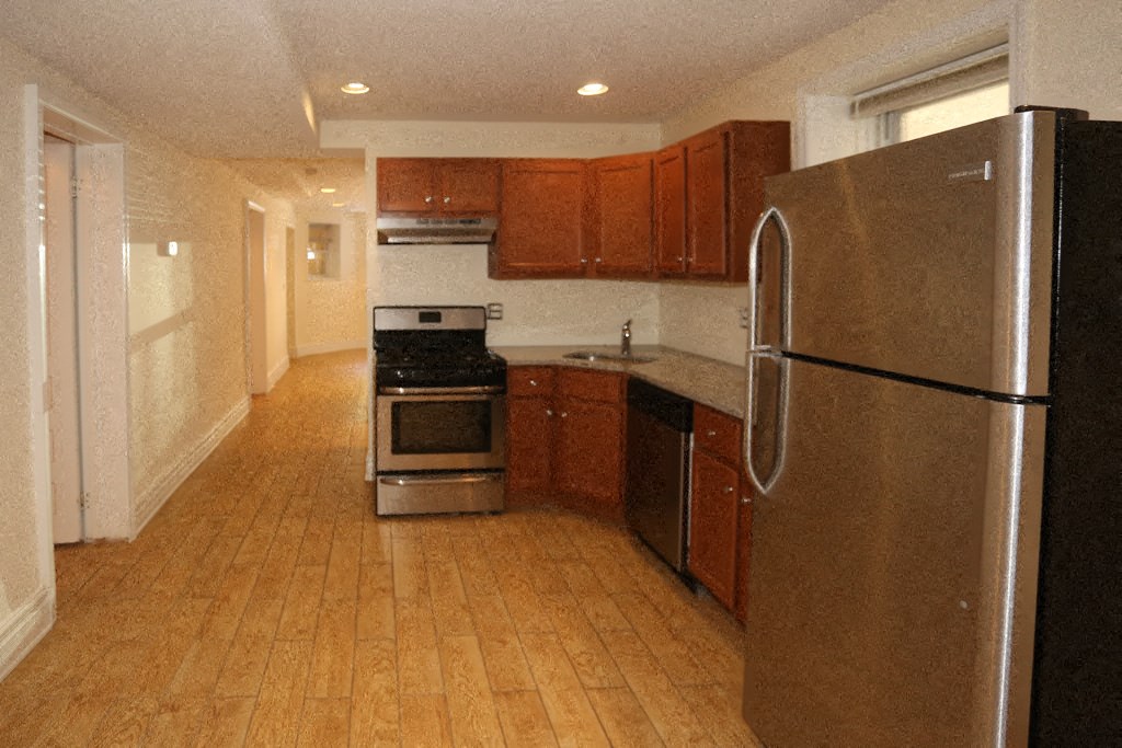 a kitchen with a stove and a refrigerator