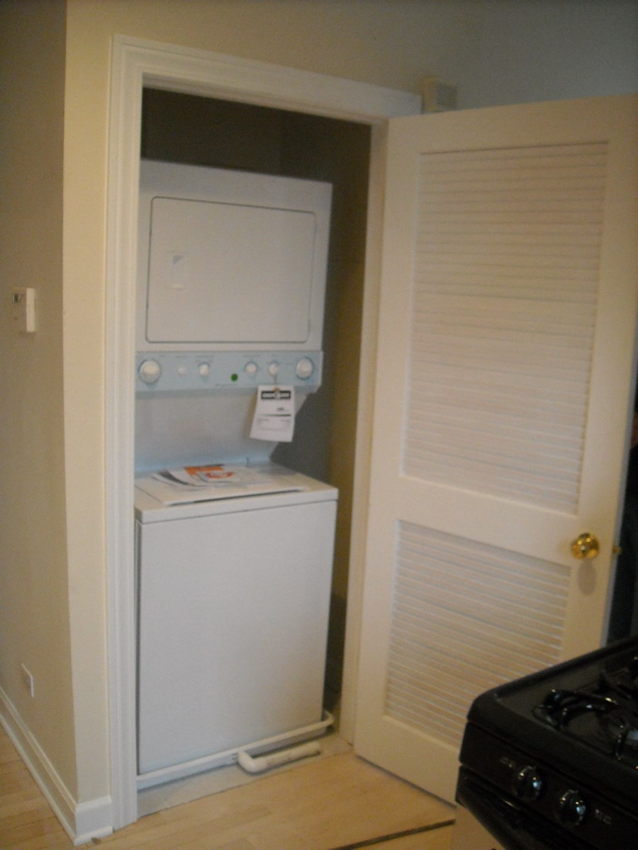 the laundry room has a washer and dryer in it