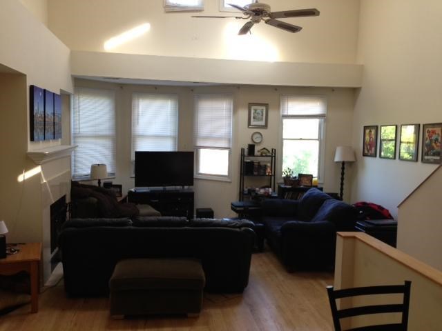 a living room with two couches and a television