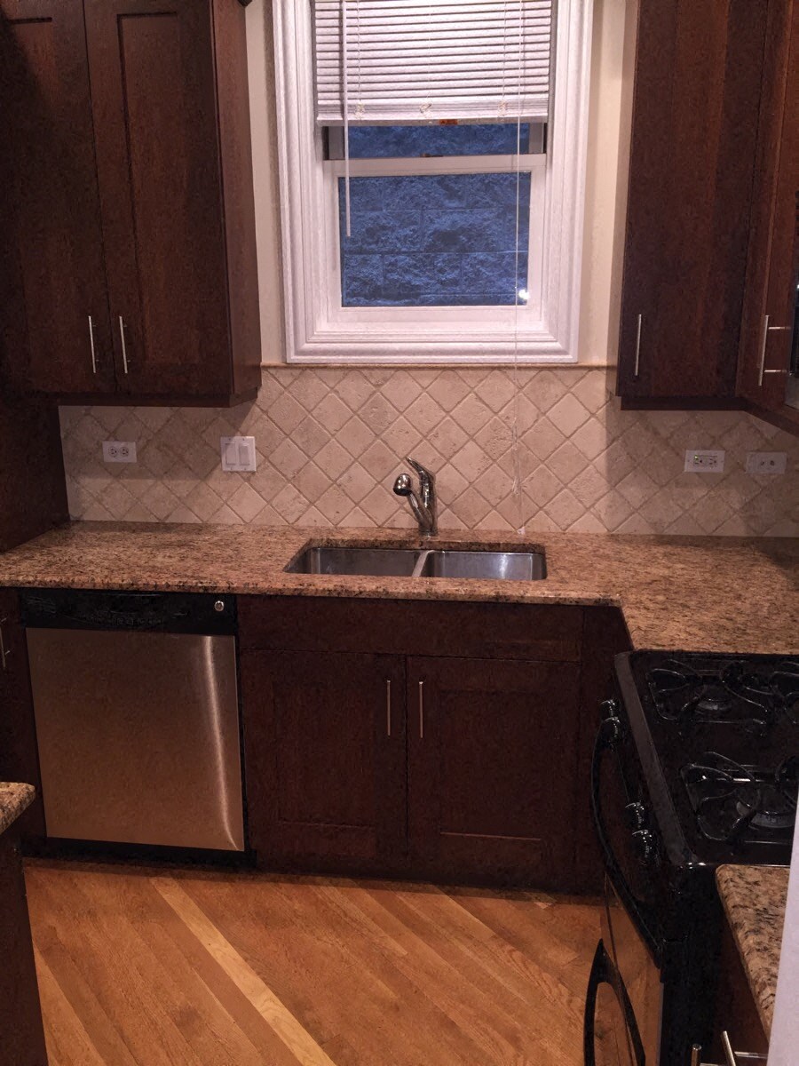 a kitchen with a sink and a window