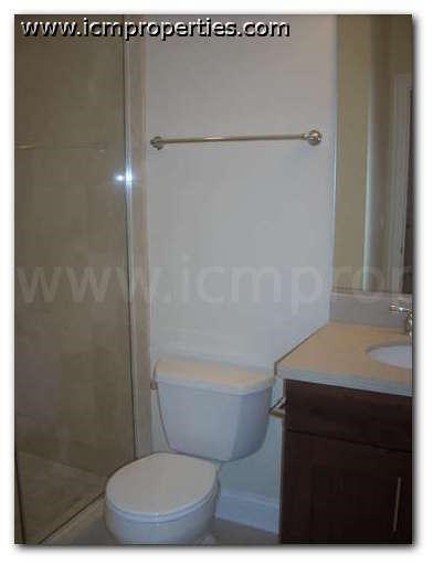 a small bathroom with a toilet and a shower