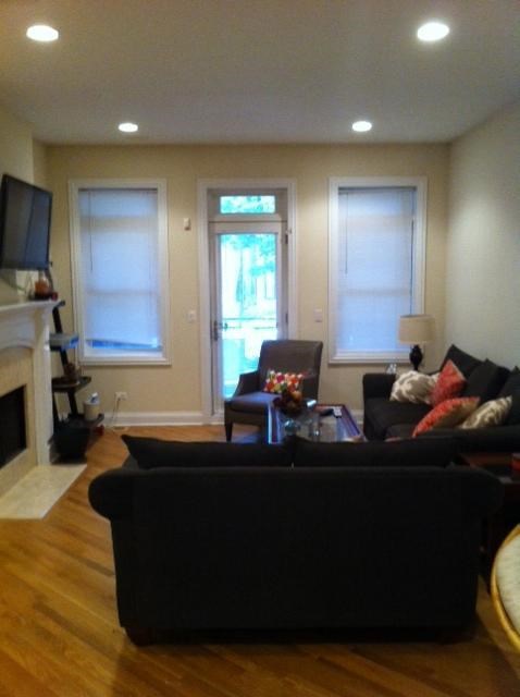 a living room with a couch and a tv