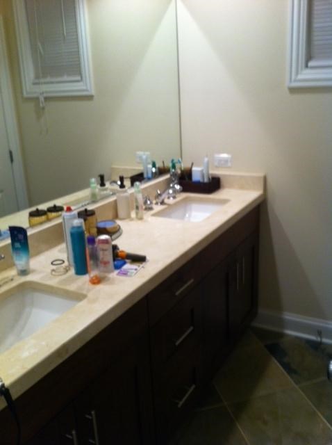 a bathroom with two sinks and a mirror