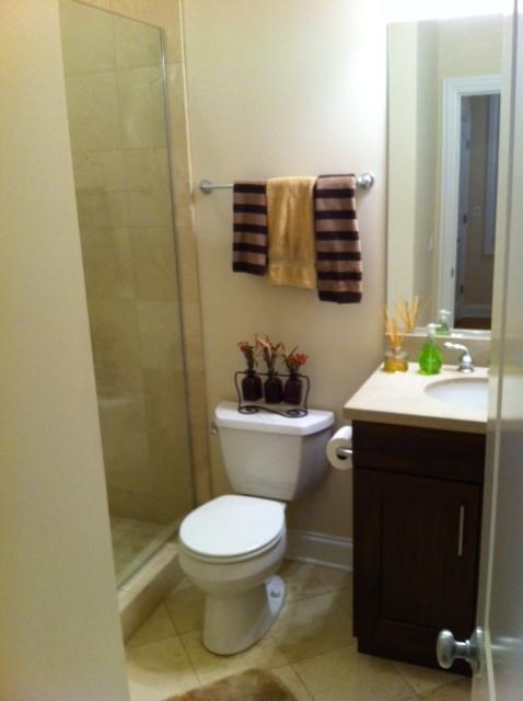 a small bathroom with a toilet and a shower